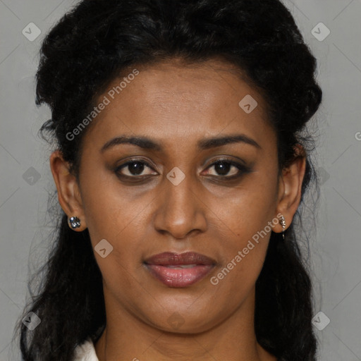 Joyful black young-adult female with long  brown hair and brown eyes