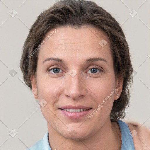 Joyful white adult female with short  brown hair and grey eyes