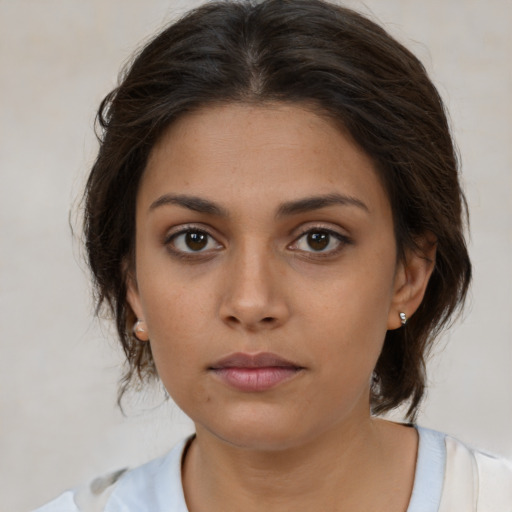 Neutral white young-adult female with medium  brown hair and brown eyes