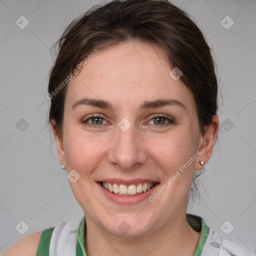 Joyful white adult female with medium  brown hair and grey eyes