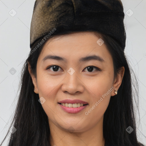 Joyful asian young-adult female with long  brown hair and brown eyes