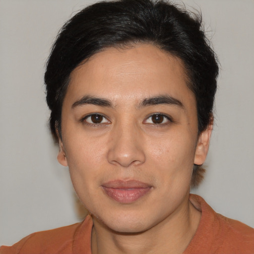 Joyful latino young-adult female with short  brown hair and brown eyes