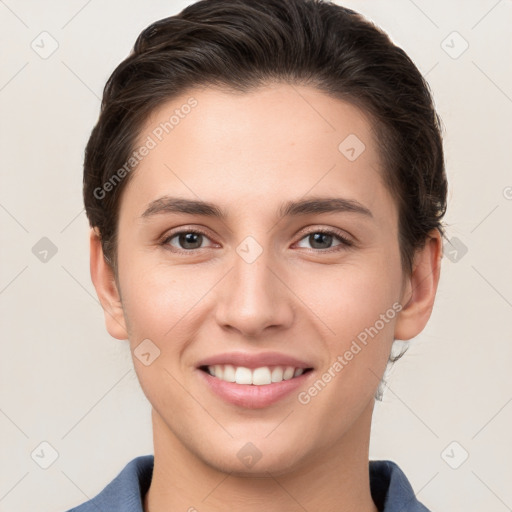 Joyful white young-adult female with short  brown hair and brown eyes