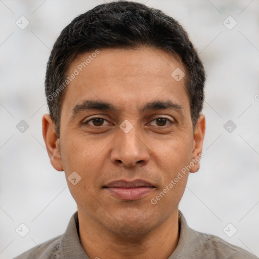 Joyful white adult male with short  brown hair and brown eyes