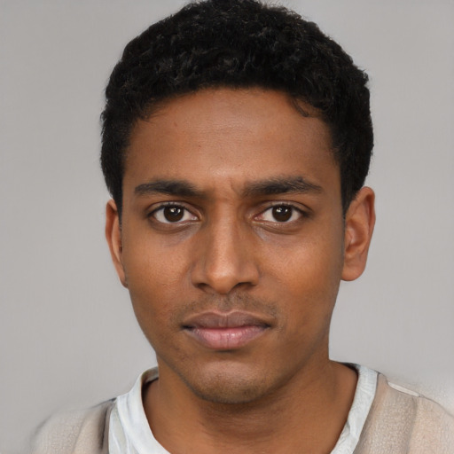 Neutral latino young-adult male with short  black hair and brown eyes