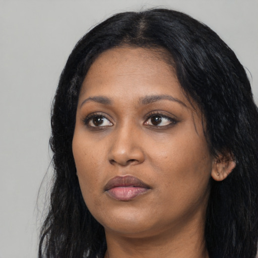 Neutral black young-adult female with long  black hair and brown eyes