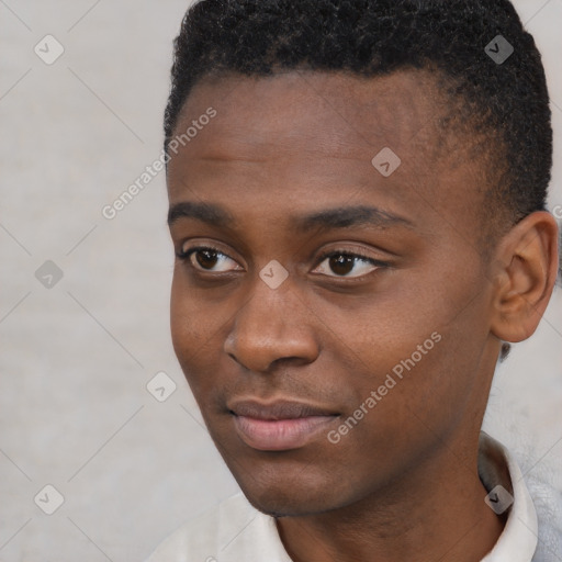 Joyful black young-adult male with short  brown hair and brown eyes