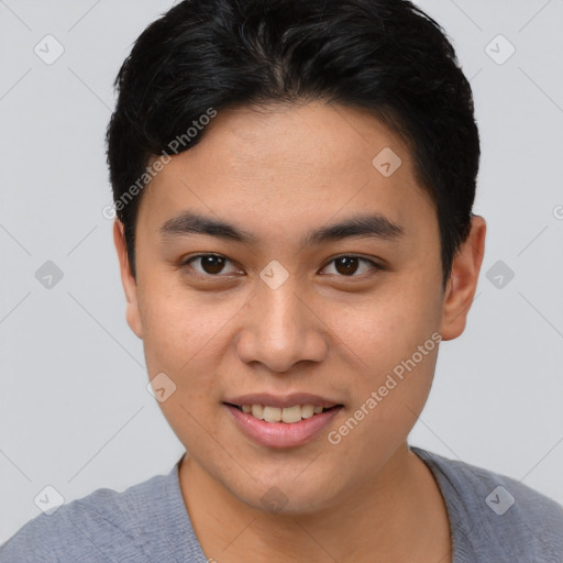 Joyful asian young-adult male with short  black hair and brown eyes