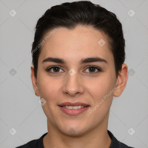 Joyful white young-adult female with short  brown hair and brown eyes