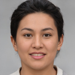 Joyful asian young-adult female with medium  brown hair and brown eyes