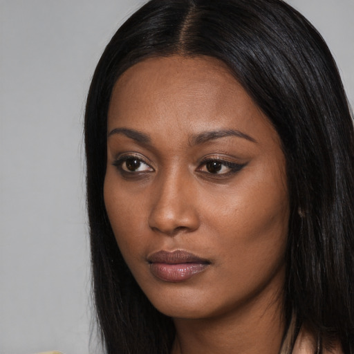 Neutral black young-adult female with long  black hair and brown eyes