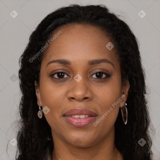 Joyful black young-adult female with long  brown hair and brown eyes