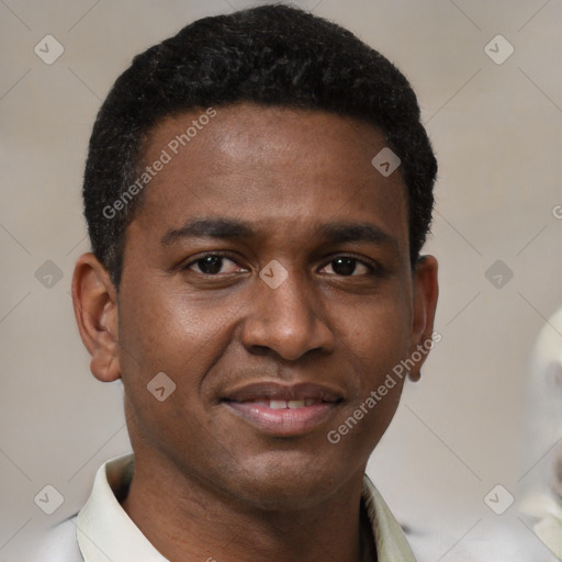 Joyful black young-adult male with short  black hair and brown eyes