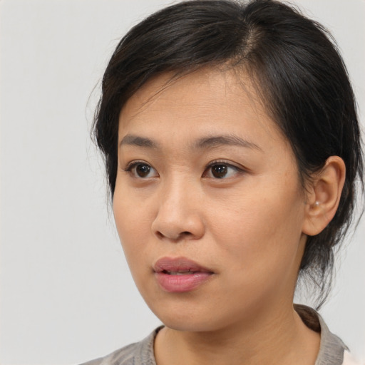 Neutral asian young-adult female with medium  brown hair and brown eyes