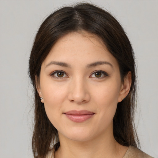 Joyful white young-adult female with medium  brown hair and brown eyes