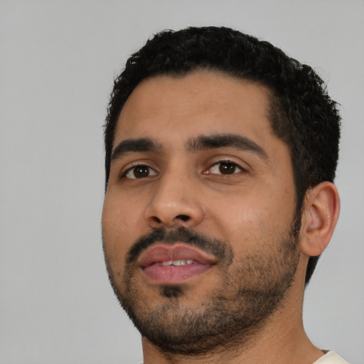 Neutral latino young-adult male with short  black hair and brown eyes