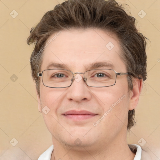 Joyful white adult male with short  brown hair and grey eyes