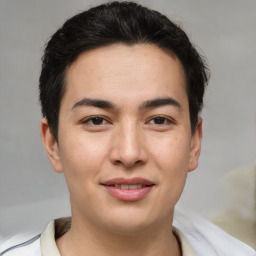 Joyful asian young-adult male with short  brown hair and brown eyes