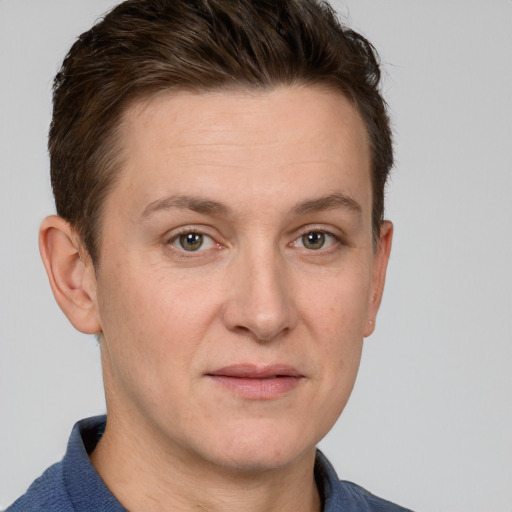 Joyful white adult female with short  brown hair and grey eyes