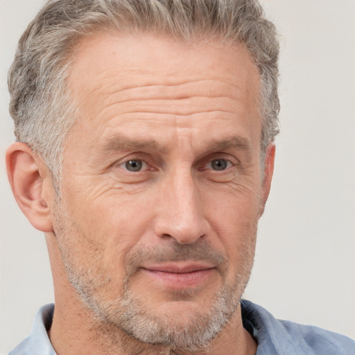 Joyful white middle-aged male with short  brown hair and brown eyes