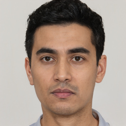 Neutral latino young-adult male with short  black hair and brown eyes