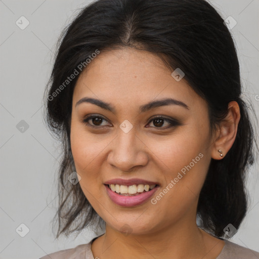 Joyful latino young-adult female with medium  brown hair and brown eyes