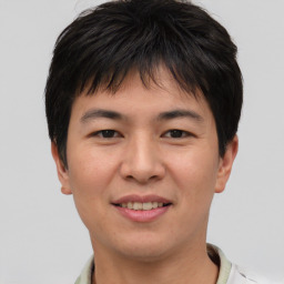 Joyful asian young-adult male with short  brown hair and brown eyes