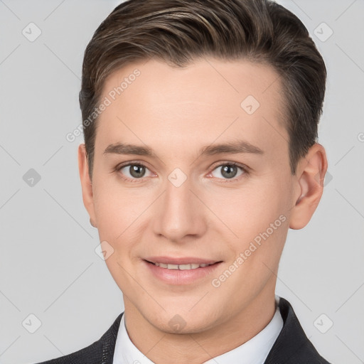 Joyful white young-adult male with short  brown hair and grey eyes