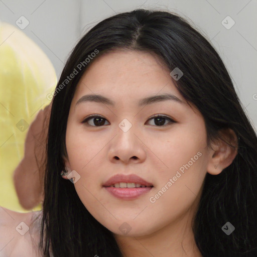 Joyful asian young-adult female with long  black hair and brown eyes