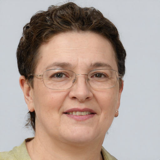 Joyful white adult female with short  brown hair and grey eyes