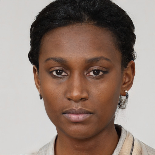 Neutral black young-adult female with short  brown hair and brown eyes