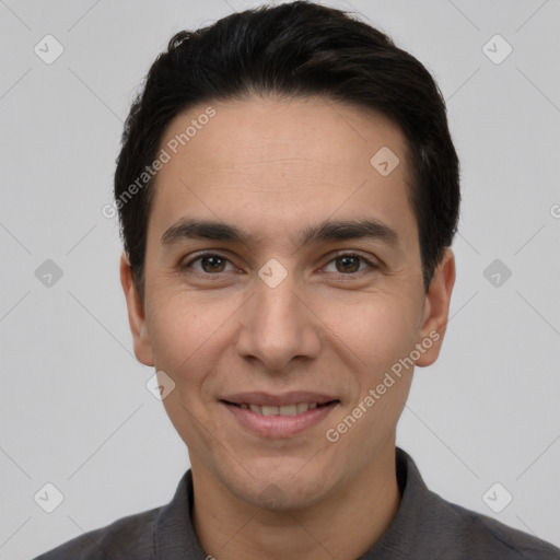 Joyful white young-adult male with short  black hair and brown eyes