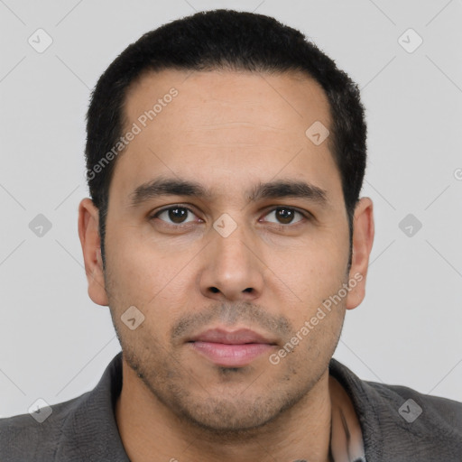 Neutral latino young-adult male with short  black hair and brown eyes