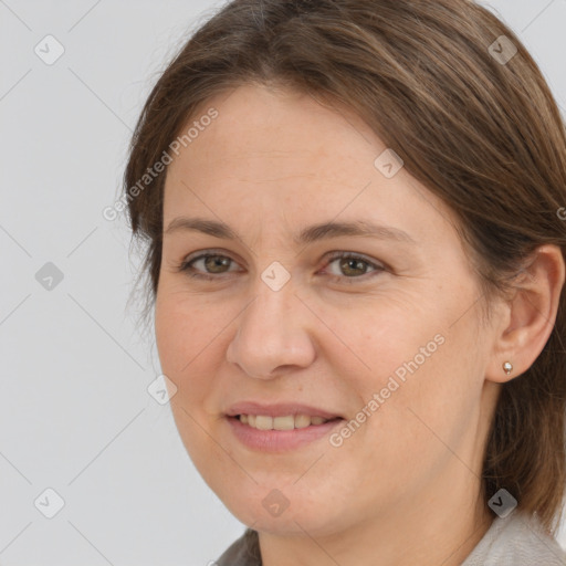 Joyful white adult female with medium  brown hair and brown eyes