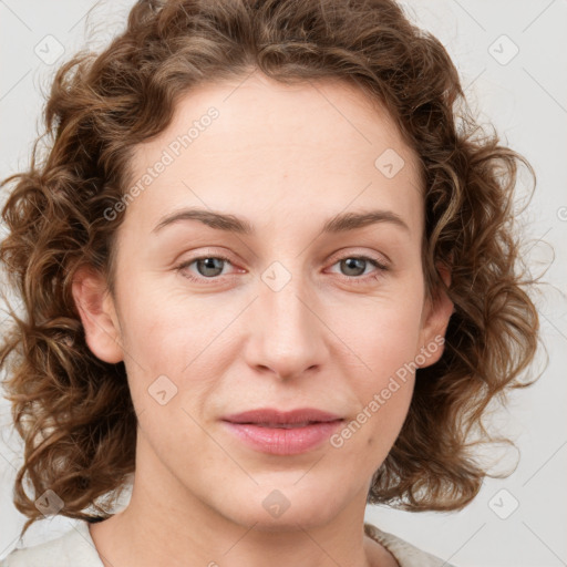 Joyful white young-adult female with medium  brown hair and blue eyes