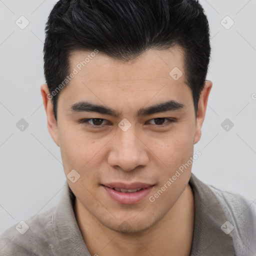 Joyful asian young-adult male with short  brown hair and brown eyes