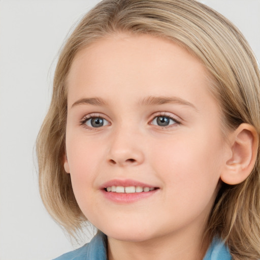 Joyful white child female with medium  brown hair and blue eyes