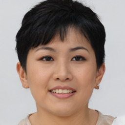 Joyful asian young-adult female with short  brown hair and brown eyes