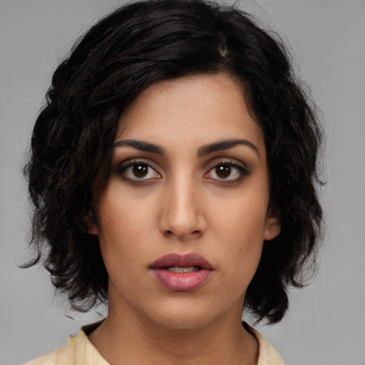 Neutral latino young-adult female with medium  black hair and brown eyes