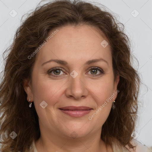 Joyful white adult female with medium  brown hair and green eyes