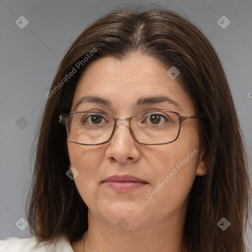 Joyful white adult female with medium  brown hair and brown eyes