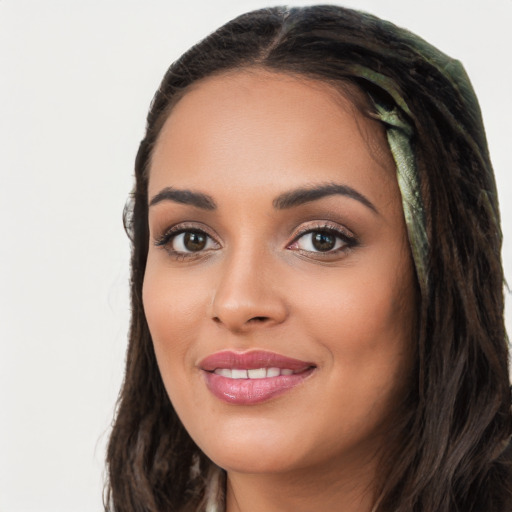 Joyful white young-adult female with long  black hair and brown eyes