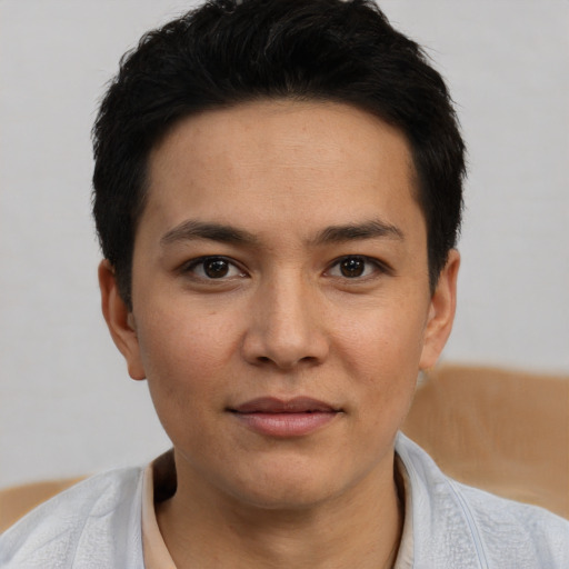 Joyful white young-adult male with short  black hair and brown eyes