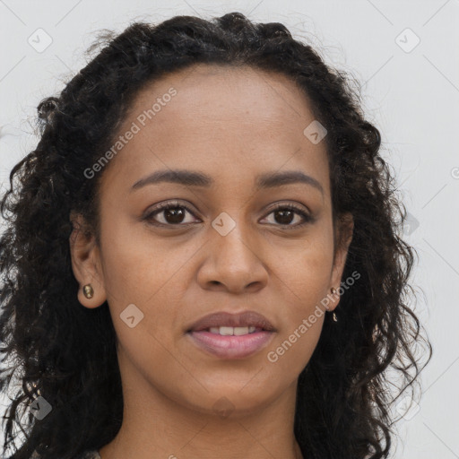 Joyful black young-adult female with long  brown hair and brown eyes