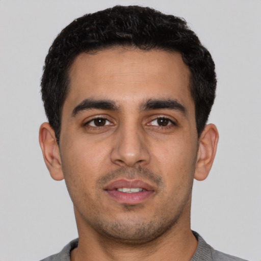 Neutral latino young-adult male with short  black hair and brown eyes