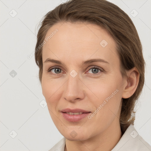 Joyful white adult female with medium  brown hair and grey eyes