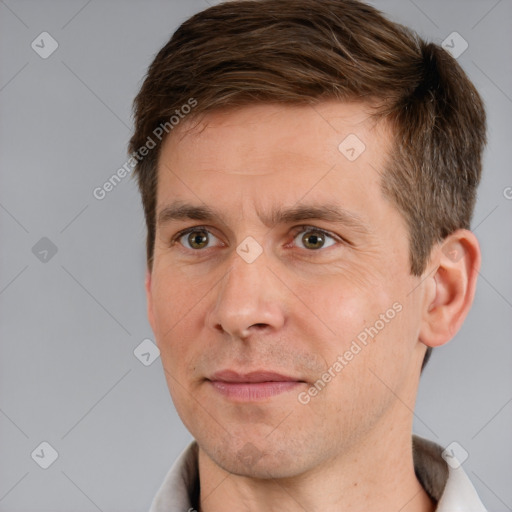 Joyful white adult male with short  brown hair and brown eyes