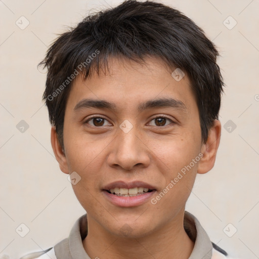 Joyful white young-adult male with short  black hair and brown eyes