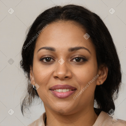 Joyful latino adult female with medium  brown hair and brown eyes