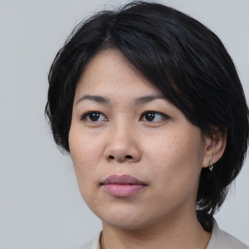 Neutral asian young-adult female with medium  black hair and brown eyes